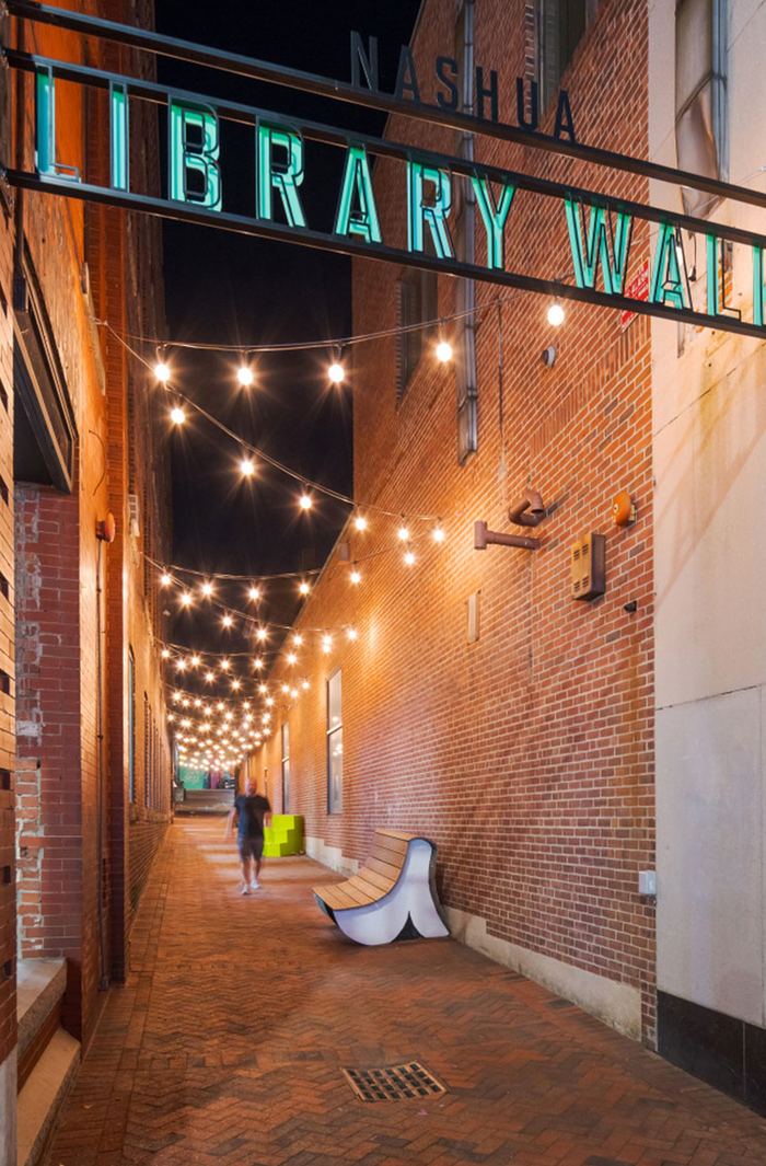 String lights over the brick Library Walk in downtown Nashua at night